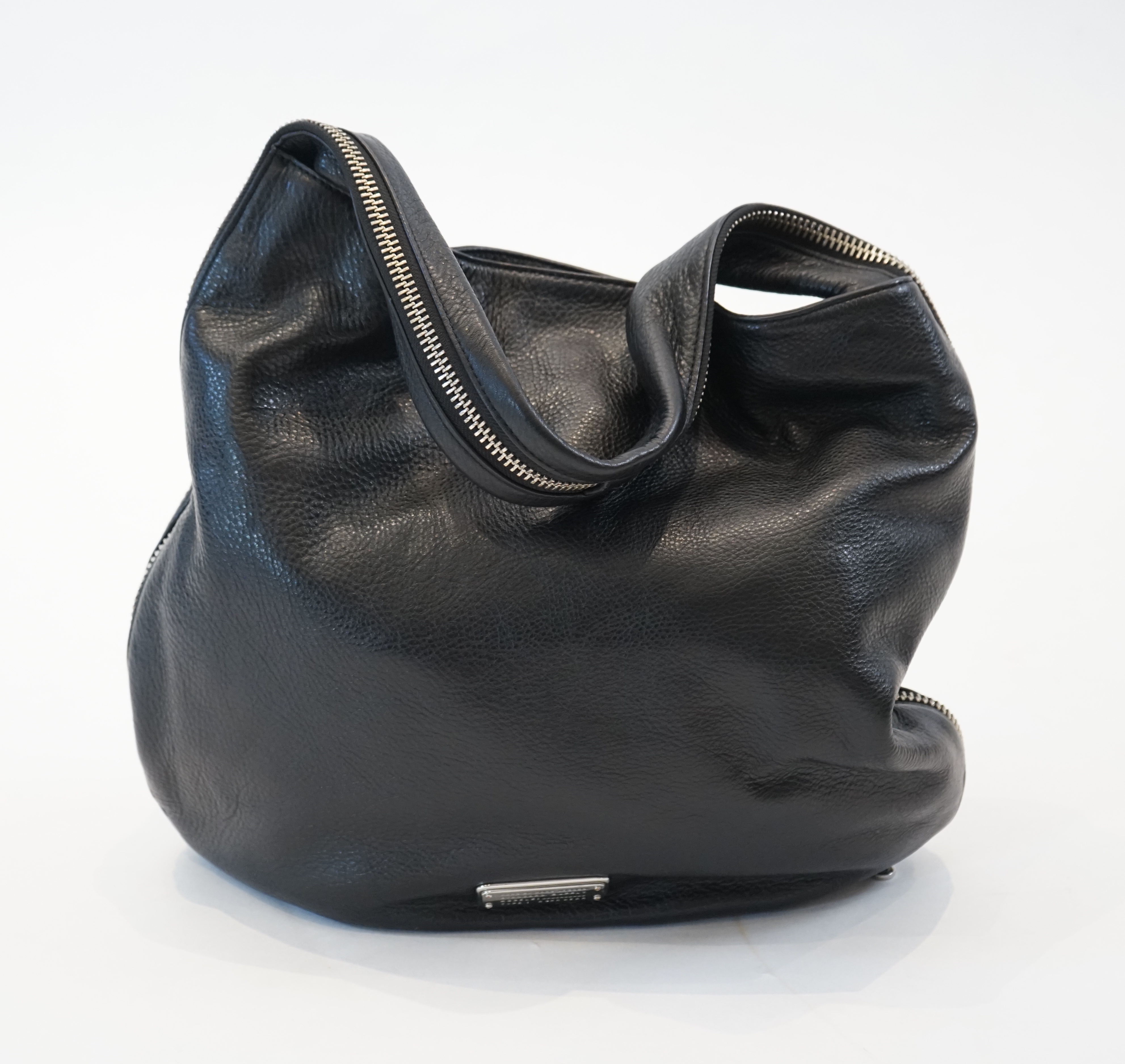 A Marc Jacobs black leather boho with silver zip detail, width 40cm, depth 15cm, height 35cm